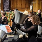 Gallery 1 - Handbell ringers plays a large aluminum bass bell