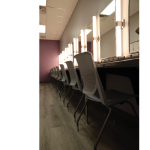 Gallery 1 - Chairs and lighting in theatre's large dressing room