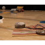 Gallery 2 - Theatre with blankets and pillows placed around the wood floor