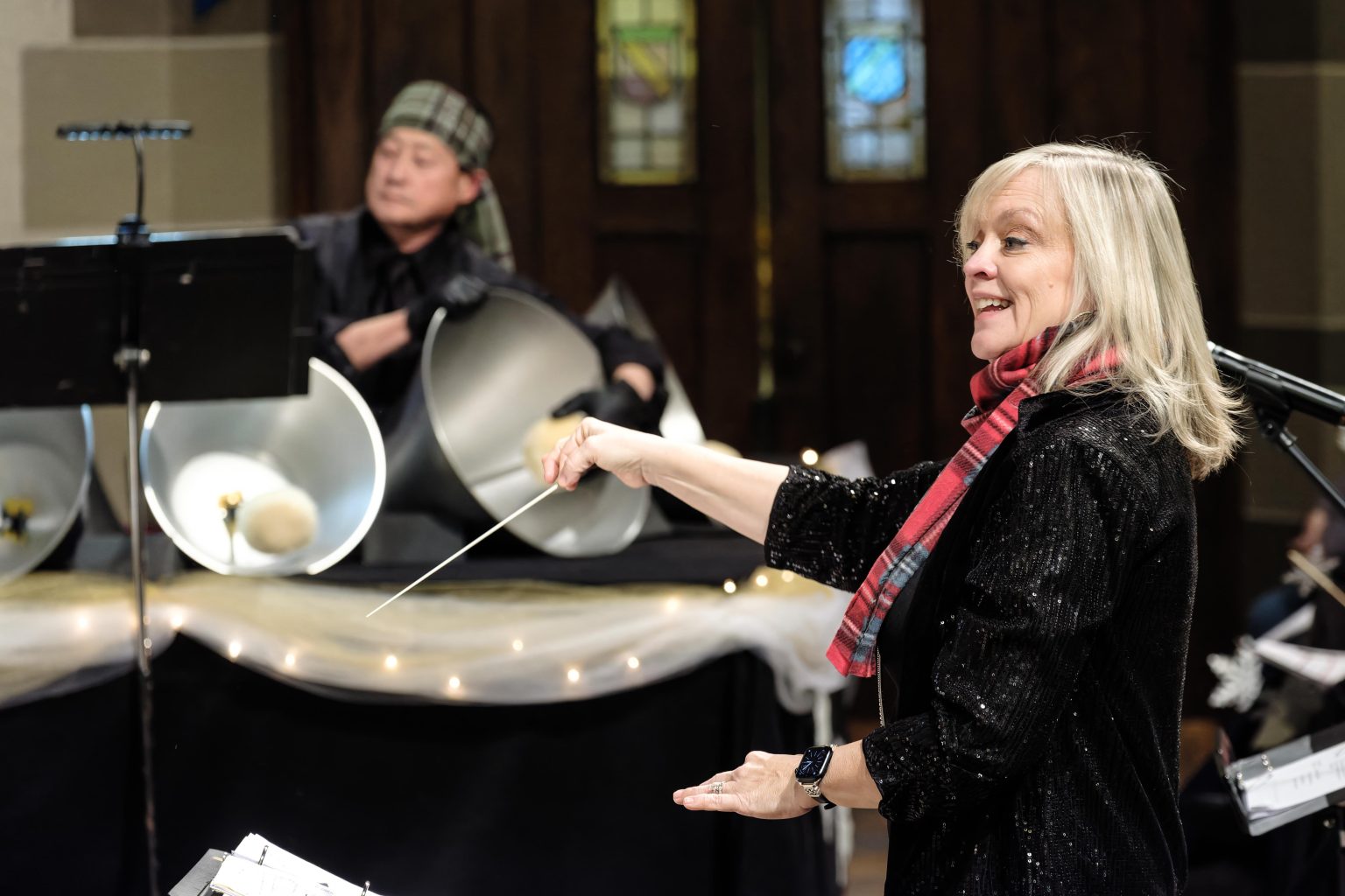 Gallery 2 - handbell choir director, with baton, in concert