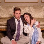 Gallery 2 - Worried couple seated on the floor leaning back on sofa